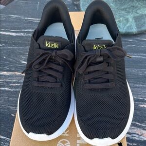 Sleek Black Sneakers with White Soles